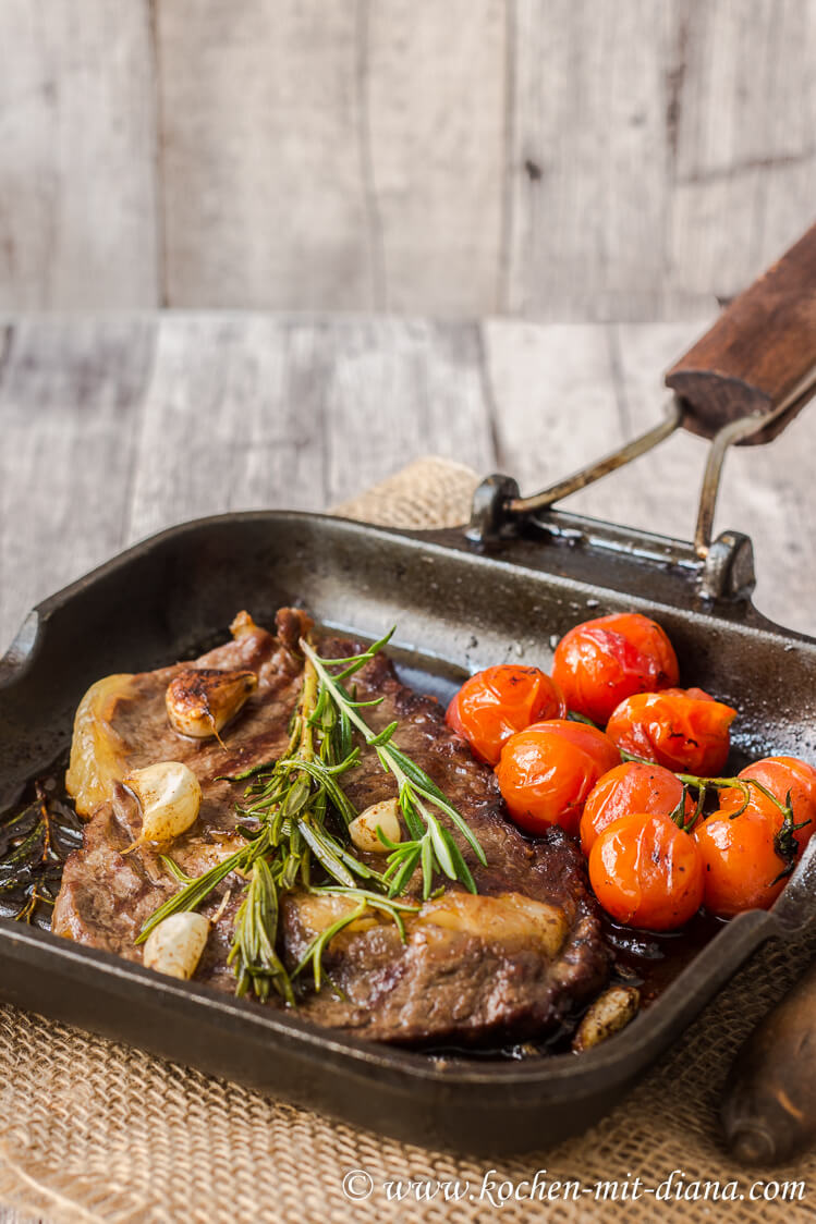 Rib-eye steak with roasted tomatoes